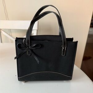 Elegant Black Handbag with Bow Accent